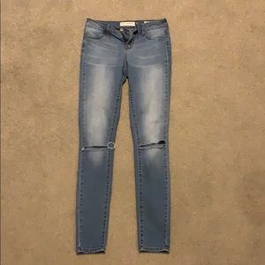 Mid rise jeans with knee slits. Worn once.